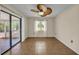 Neutral living room with tiled floor, sliding glass door, and window, offering a bright and inviting space at 55 Mark Twain Ln, Rotonda West, FL 33947