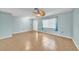 Bright living room featuring tiled floors, neutral walls, and a stylish ceiling fan at 55 Mark Twain Ln, Rotonda West, FL 33947