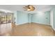 Spacious living room with tiled floors, light-colored walls, and access to the lanai at 55 Mark Twain Ln, Rotonda West, FL 33947