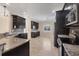 Modern kitchen with granite countertops and stainless steel appliances at 576 Box Elder Ct, Englewood, FL 34223
