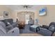Spacious living room showcasing an open floor plan and a large flat screen television at 576 Box Elder Ct, Englewood, FL 34223