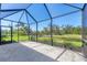 View from the screened in lanai overlooking a peaceful water view at 576 Box Elder Ct, Englewood, FL 34223