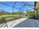 Enjoy outdoor living on this screened lanai, with a relaxing view of the backyard and greenery at 576 Box Elder Ct, Englewood, FL 34223