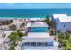 Aerial view showcasing the house's proximity to the beach and the nearby properties in this coastal community at 70 Wilhelm Dr, Englewood, FL 34223
