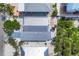 Aerial view showcasing the layout of the house with neighboring properties, lush landscaping, and private yard space at 70 Wilhelm Dr, Englewood, FL 34223