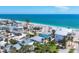 Aerial view of the house and community near the beach, offering a glimpse of coastal living and waterfront access at 70 Wilhelm Dr, Englewood, FL 34223