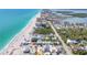 Panoramic aerial shot of the beach community, showcasing houses, coastline, and the adjacent bay area at 70 Wilhelm Dr, Englewood, FL 34223
