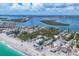 Picturesque aerial view of beachfront homes nestled amidst lush greenery and scenic waterways at 70 Wilhelm Dr, Englewood, FL 34223