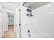 Bathroom features a tiled shower with modern fixtures at 70 Wilhelm Dr, Englewood, FL 34223