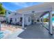 Exterior view of home with carport and colorful landscaping at 70 Wilhelm Dr, Englewood, FL 34223