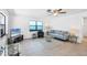 Comfortable living room with large windows and contemporary furnishings at 70 Wilhelm Dr, Englewood, FL 34223