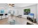 Open living space with kitchen access and beach view TV at 70 Wilhelm Dr, Englewood, FL 34223