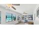 Bright sunroom with large windows, tile flooring, and comfortable seating at 70 Wilhelm Dr, Englewood, FL 34223