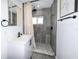 Bathroom features updated shower with mosaic tile, modern vanity, and matte black fixtures at 700 Floral Ln, Port Charlotte, FL 33952