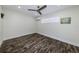 This bedroom has an ample amount of natural light and the floors have a wood grain finish at 700 Floral Ln, Port Charlotte, FL 33952