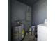 Functional laundry space with water heater and updated circuits providing essential utilities at 700 Floral Ln, Port Charlotte, FL 33952