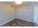 Bright room featuring modern flooring, window, and closet at 700 Floral Ln, Port Charlotte, FL 33952