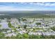 Panoramic aerial view showcasing a waterfront community with lush landscaping and winding waterways at 742 Portwine Ct # 17, Englewood, FL 34223