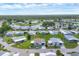 Expansive aerial shot featuring well-kept homes in a peaceful lakeside community with green spaces at 742 Portwine Ct # 17, Englewood, FL 34223