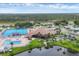 An aerial view of community with a pool, tennis court and pond in a beautiful setting at 742 Portwine Ct # 17, Englewood, FL 34223