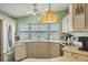 Bright kitchen boasts stainless steel appliances, a window over the sink, and neutral countertops at 742 Portwine Ct # 17, Englewood, FL 34223