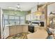 Functional kitchen features classic appliances, a bay window, and ample counter space at 742 Portwine Ct # 17, Englewood, FL 34223