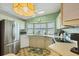 Well-lit kitchen offers stainless steel appliances, a window over the sink, and ample storage at 742 Portwine Ct # 17, Englewood, FL 34223