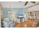 Inviting living room boasts charming decor and cozy seating, with an adjacent dining area at 742 Portwine Ct # 17, Englewood, FL 34223
