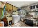 Functional utility room equipped with a washer, dryer, sink, grill, and ample storage space at 742 Portwine Ct # 17, Englewood, FL 34223