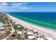 Aerial view showcases the pristine beach, waterfront location and surrounding community at 7554 Palm Island S Dr # 1813, Placida, FL 33946