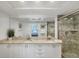 Well-lit bathroom featuring double sinks, granite countertops, and a glass-enclosed shower at 7554 Palm Island S Dr # 1813, Placida, FL 33946