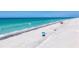 Relaxing beach view featuring beach umbrellas and calm turquoise water, perfect for leisure at 7554 Palm Island S Dr # 1813, Placida, FL 33946