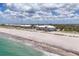 Expansive beachfront property showcasing beautiful condos along a white sand beach with stunning ocean views at 7554 Palm Island S Dr # 1813, Placida, FL 33946