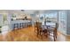Bright dining area with breakfast bar, large windows, and hardwood flooring, perfect for Gathering meals at 7554 Palm Island S Dr # 1813, Placida, FL 33946