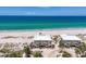 Lovely beachfront homes with balconies and stairs on a pristine white sand beach at 7554 Palm Island S Dr # 1813, Placida, FL 33946