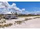 Beautiful beach home with multiple decks and a staircase down to the white sandy beach at 7554 Palm Island S Dr # 1813, Placida, FL 33946