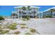 Two-story beach house with white stairs leading to decks at 7554 Palm Island S Dr # 1813, Placida, FL 33946