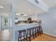 Open kitchen with breakfast bar, stainless steel appliances, and seamless access to other living areas at 7554 Palm Island S Dr # 1813, Placida, FL 33946