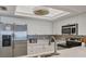 Modern kitchen features stainless steel appliances and sleek white cabinetry at 7554 Palm Island S Dr # 1813, Placida, FL 33946