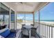 Inviting screened patio with outdoor seating and stunning beach views at 7554 Palm Island S Dr # 1813, Placida, FL 33946