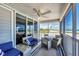 Relaxing screened porch with beach views and comfortable seating at 7554 Palm Island S Dr # 1813, Placida, FL 33946