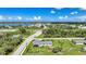 Aerial view of a house in a quiet area near roadways and water at 7690 Castleberry Ter, Englewood, FL 34224