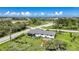 High aerial view showcasing the house and property near surrounding bodies of water at 7690 Castleberry Ter, Englewood, FL 34224