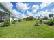 Spacious backyard featuring a shed and ample green space at 7690 Castleberry Ter, Englewood, FL 34224