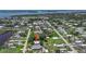 Wide aerial view of the neighborhood and surrounding waterways at 8224 Pinetree Ln, Englewood, FL 34224