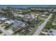 Scenic aerial view of waterfront homes with private boat docks on the tranquil canal at 8224 Pinetree Ln, Englewood, FL 34224