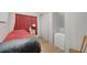 Simple bedroom with neutral walls, closet storage, and a comfortable bed at 8224 Pinetree Ln, Englewood, FL 34224