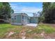 Exterior view of a charming home with a quaint patio area at 8224 Pinetree Ln, Englewood, FL 34224