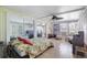 Inviting sunroom offering ample natural light, tile flooring, and comfortable seating arrangements at 8224 Pinetree Ln, Englewood, FL 34224