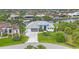 Aerial view of a lovely single-Gathering home situated on waterfront property with lush landscaping at 10079 Lebanon Dr, Port Charlotte, FL 33981